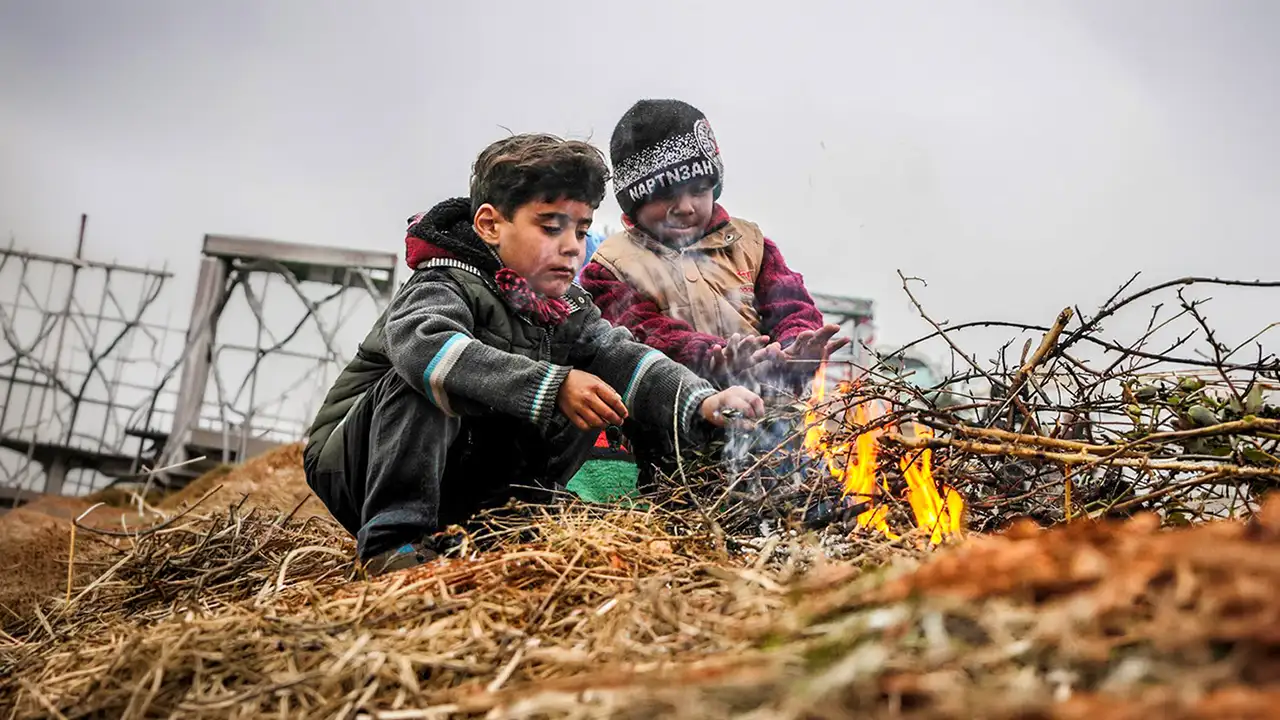 Displaced Syrian child wearing a warm winter jacket